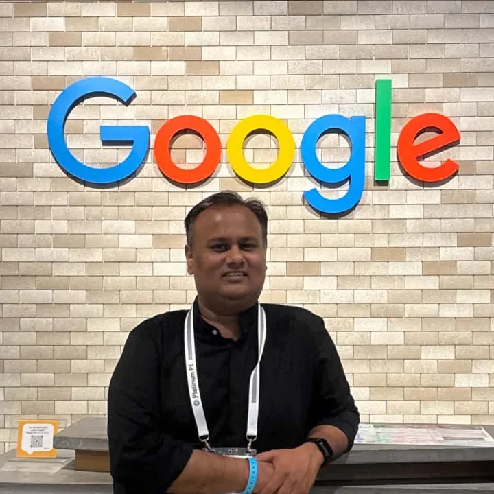 Vinay Toshniwal at a Google office wearing a Platinum Product Expert lanyard